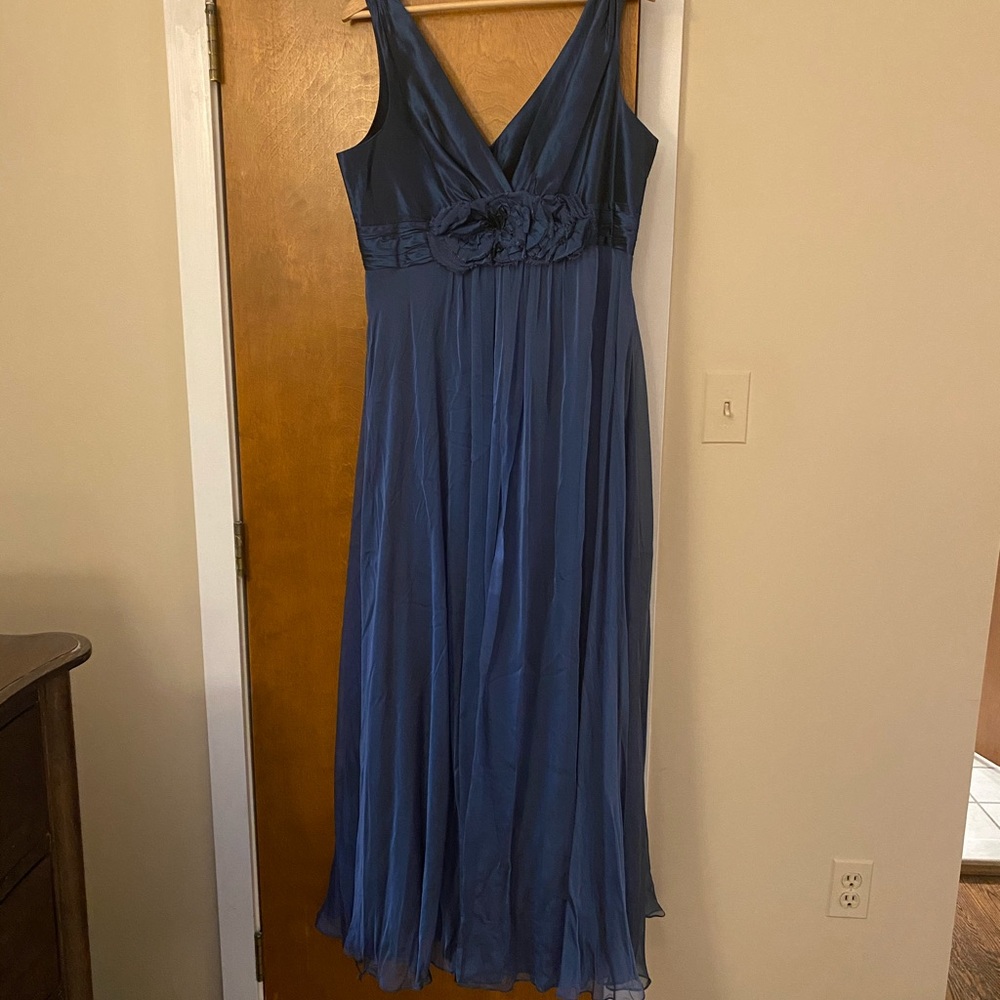 Beautiful blue evening gown with unique details.